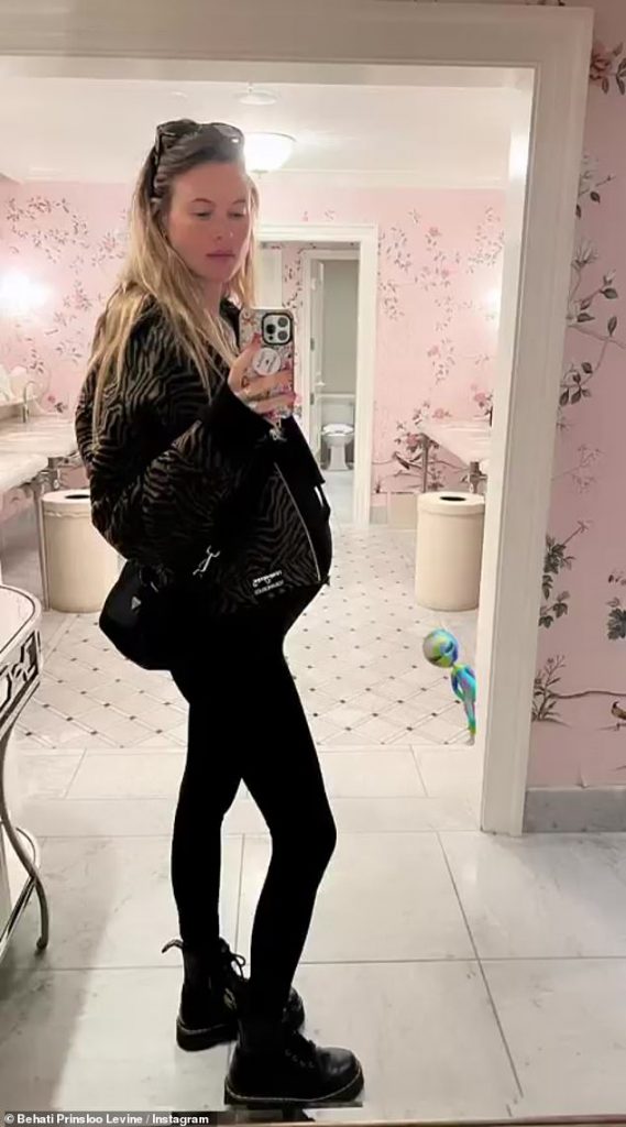 Baby on board: Behati Prinsloo put her baby bump on full display in a new bathroom mirror selfie, in which she turned to the side to make her burgeoning belly more noticeable